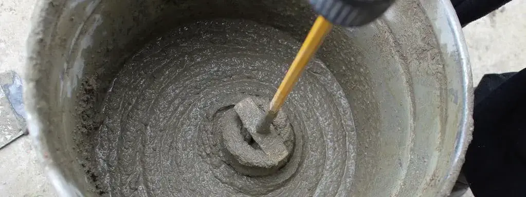 Mix concrete DIY style  mixing concrete in a wheelbarrow
